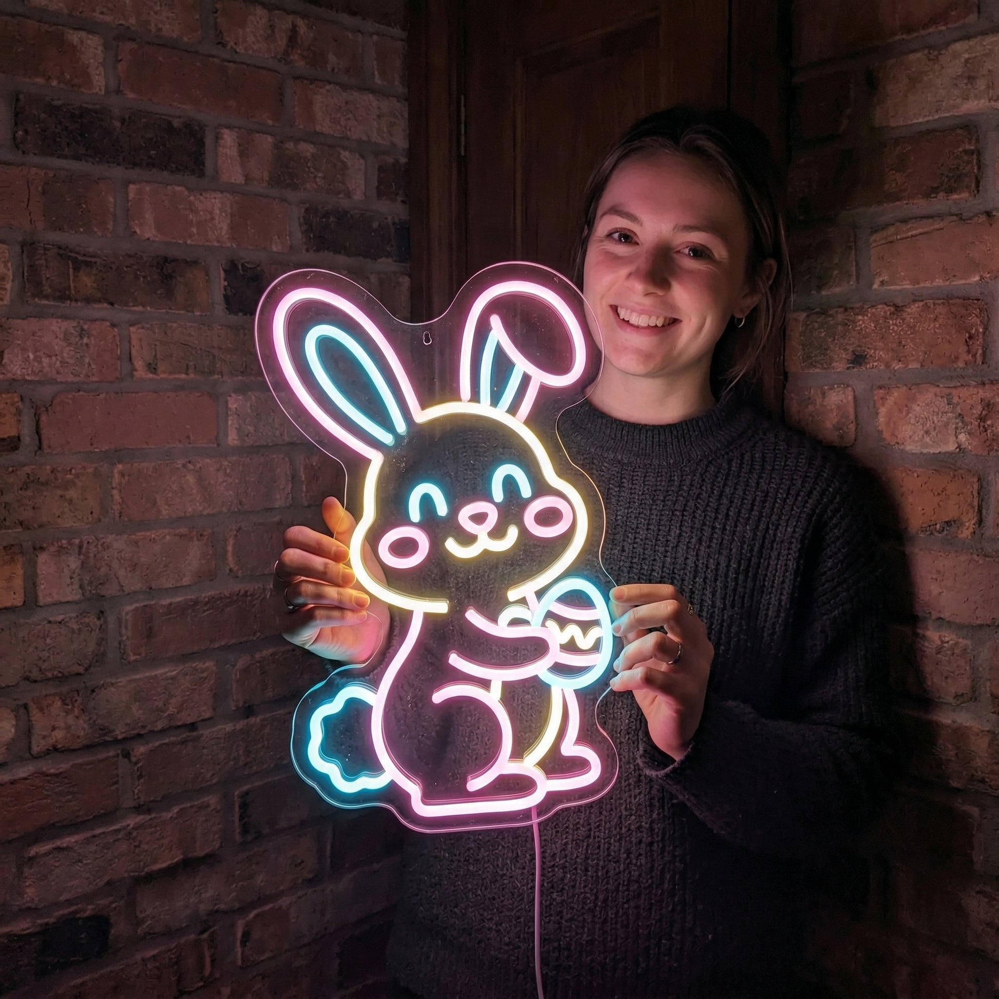 Bunny Neon Sign lifestyle photo - person holding the sign